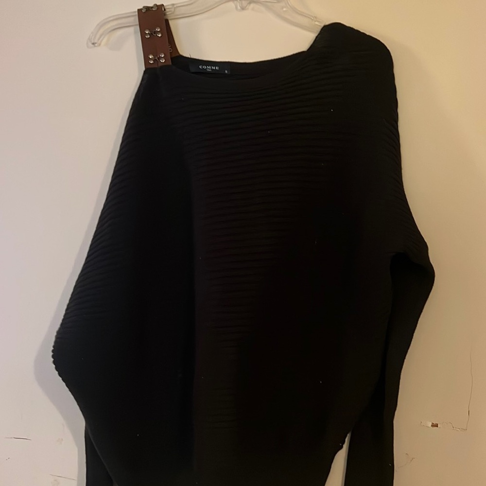 Black knit sweater with leather shoulder strap